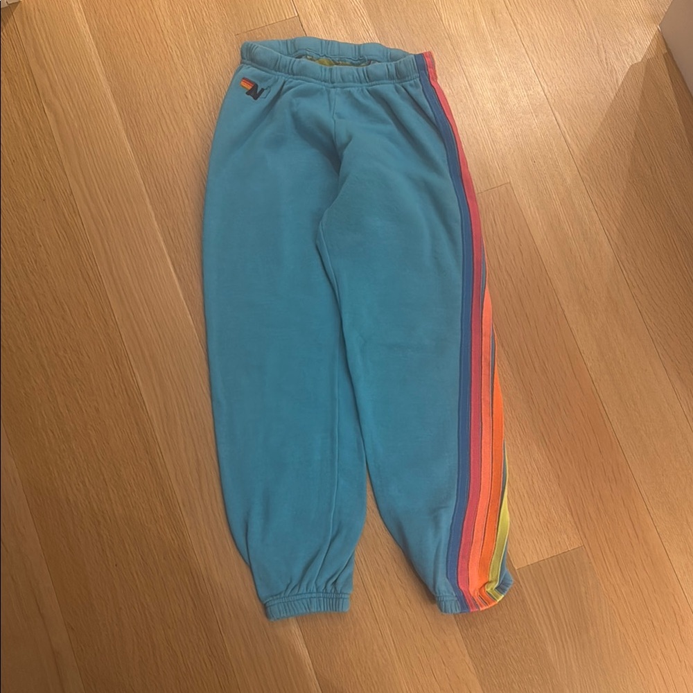 Aviator Nation Blue sweatpants with rainbow Stripe